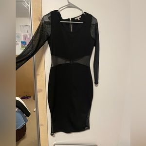 Long sleeve, see through (in some places) black dress
